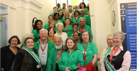 Group of Friends of Moorfields volunteers standing on stairs