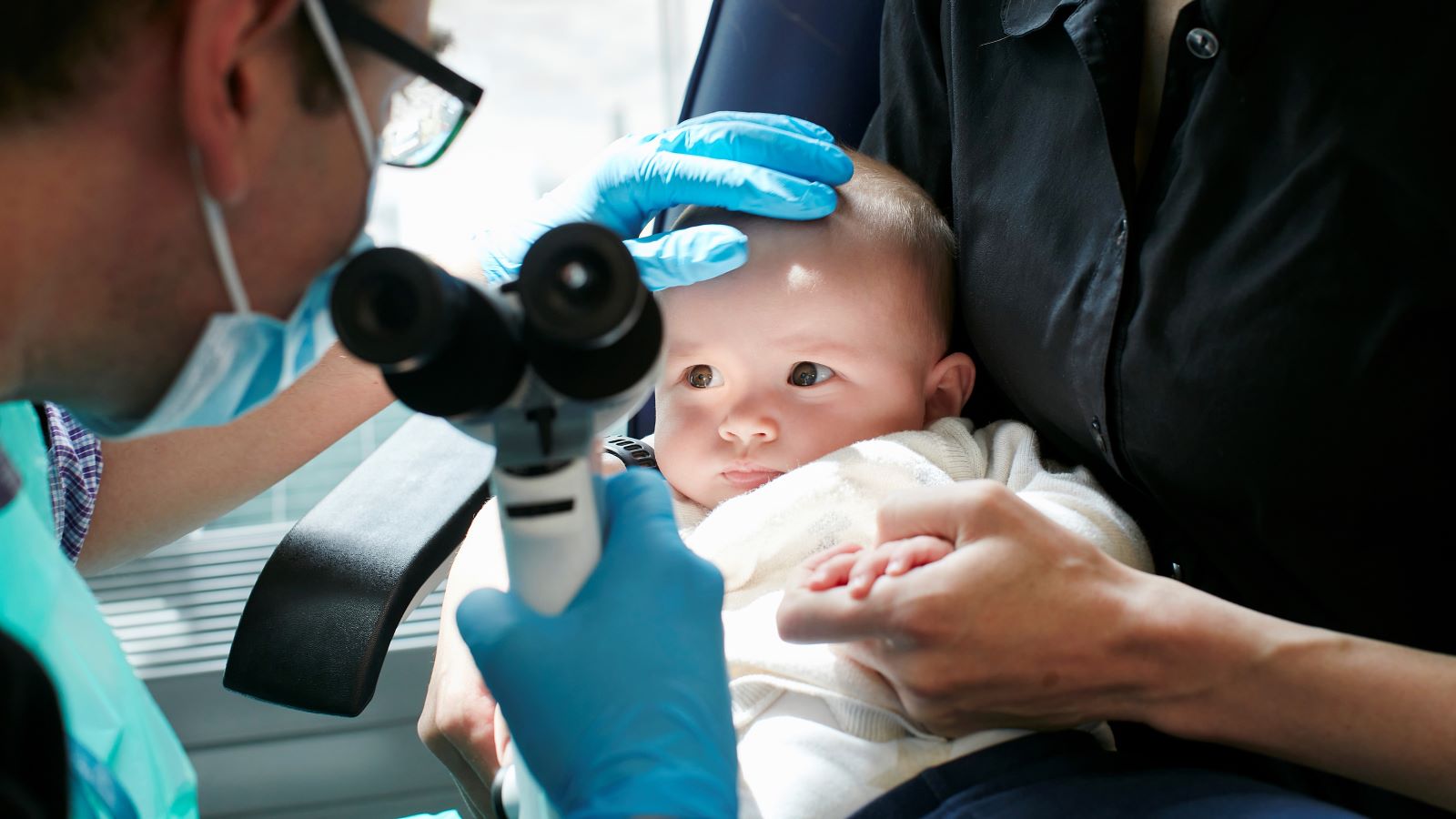 Infant having their eyes checked at RDCEC