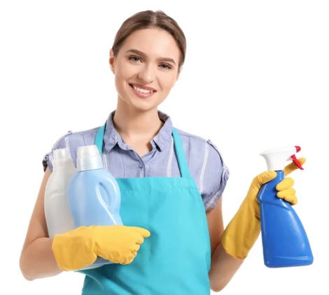 Person in apron holding bottles of cleaning supplies