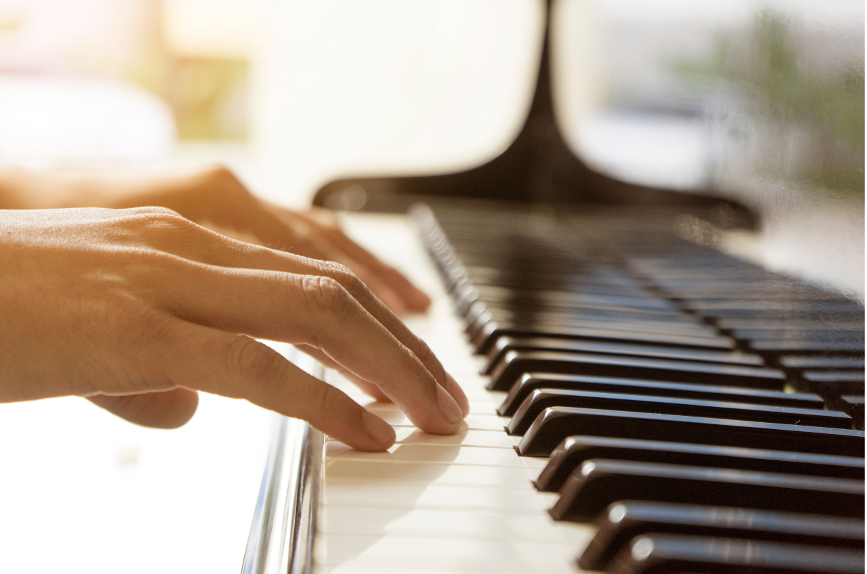Hands of a person playing piano