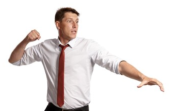 Person with their right fist pulled back in a pre-punch position