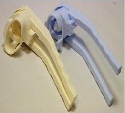 Two eye drop insertion aids next to each other