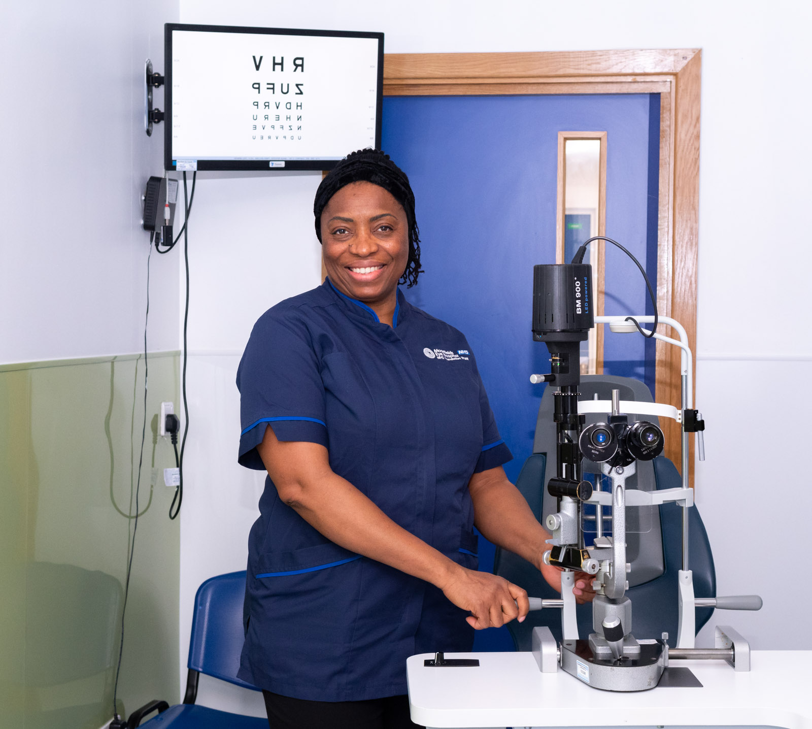 Moorfields staff member with medical equipment 