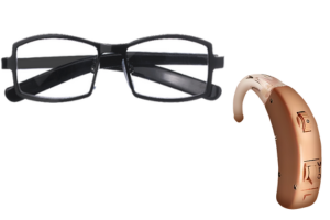 Hearing Aid and black rimmed glasses on a white background