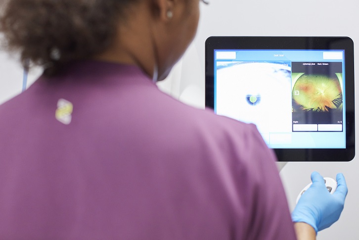 Photo of consultant looking at screen