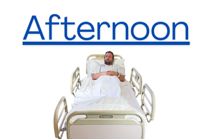 Person in a hospital bed with the rails up and the word 'afternoon' written and underlined above their head. 